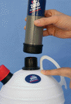 Fitting the tube cap and pump onto the container