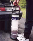 A Big PELA oil extractor used next to a car