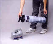 Pouring the extracted oil into a container, held upright
